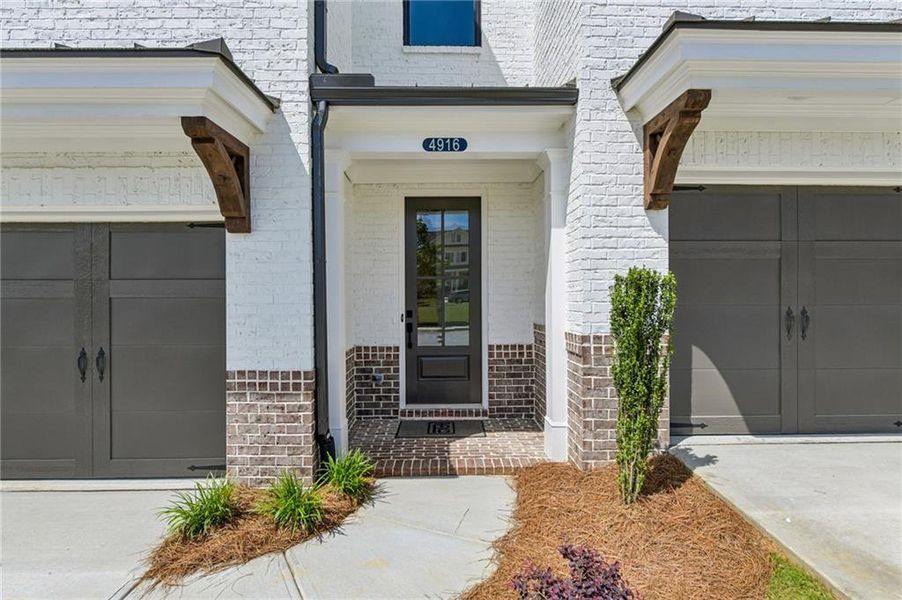 Exterior details and patio area of a home in Millcroft Townhomes, Buford (Image 3). Exterior details and patio area of a home in Millcroft Townhomes, Buford (Image 3).