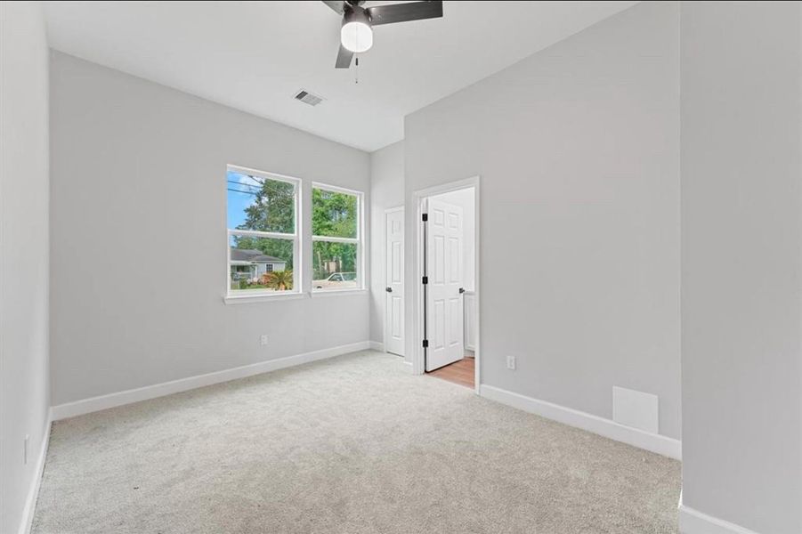 Second primary bedroom with en-suite bathroom and walk-in closet. Can be converted into home office or at-home gym. Second primary bedroom with en-suite bathroom and walk-in closet. Can be converted into home office or at-home gym.