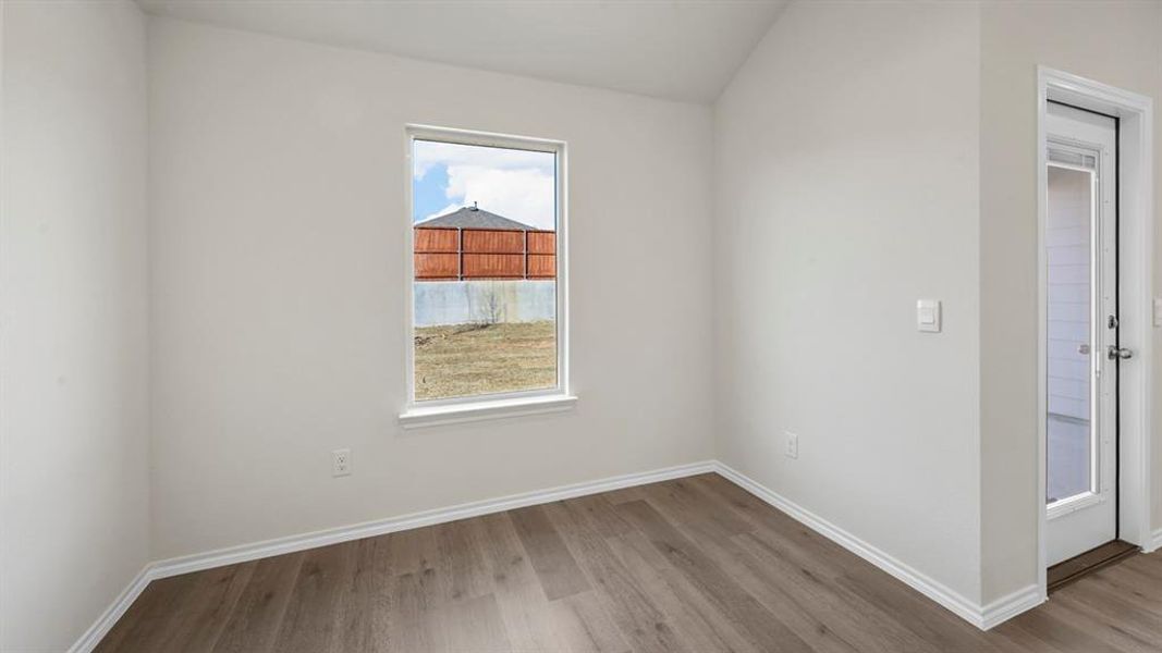 Empty room featuring wood finished floors
