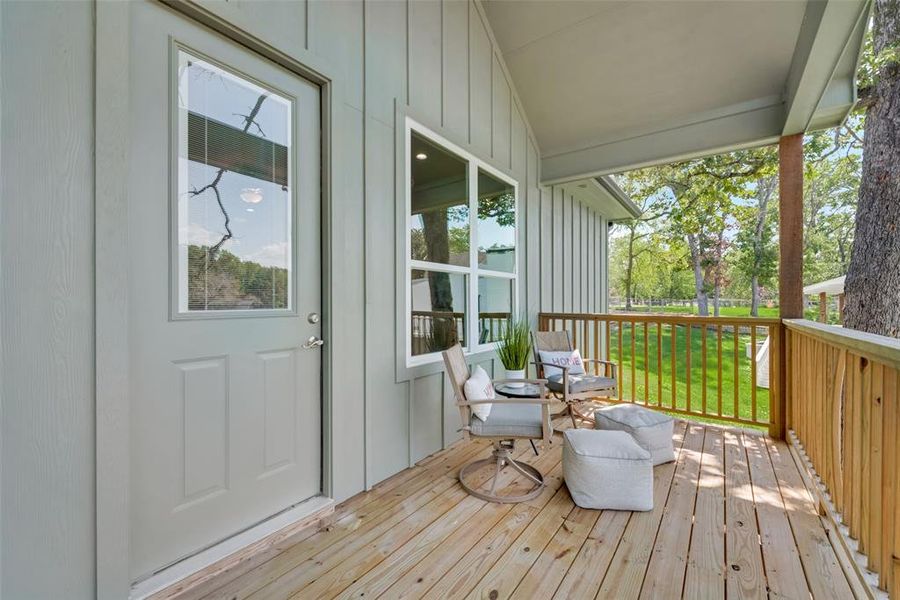 Wooden deck featuring a lawn