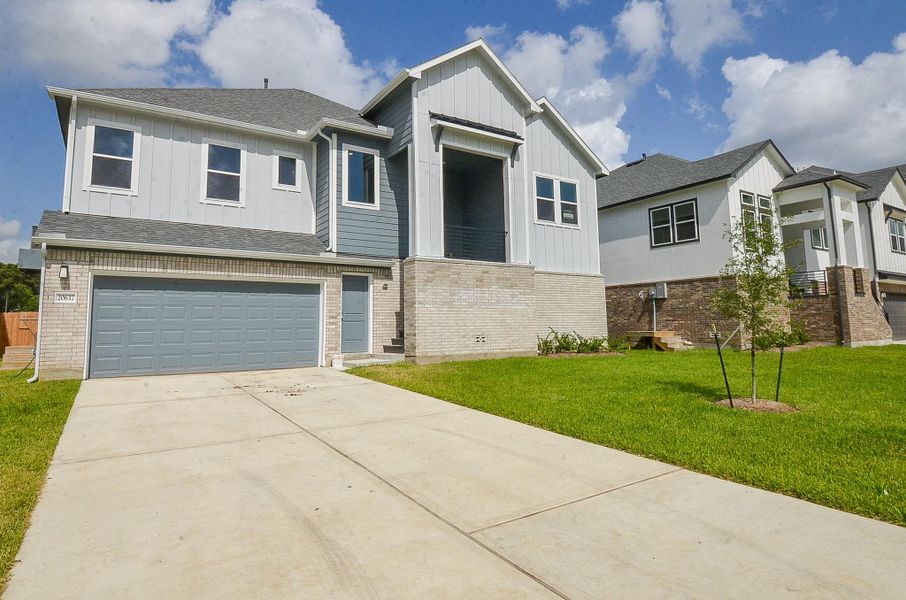 A sleek, two-car garage offers ample parking and storage. A sleek, two-car garage offers ample parking and storage.