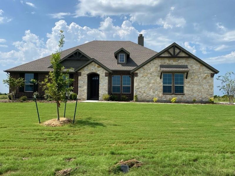 Front exterior of a new home in Clear Sky Addition, Valley View, TX, highlighting curb appeal (Image 1). Front exterior of a new home in Clear Sky Addition, Valley View, TX, highlighting curb appeal (Image 1).