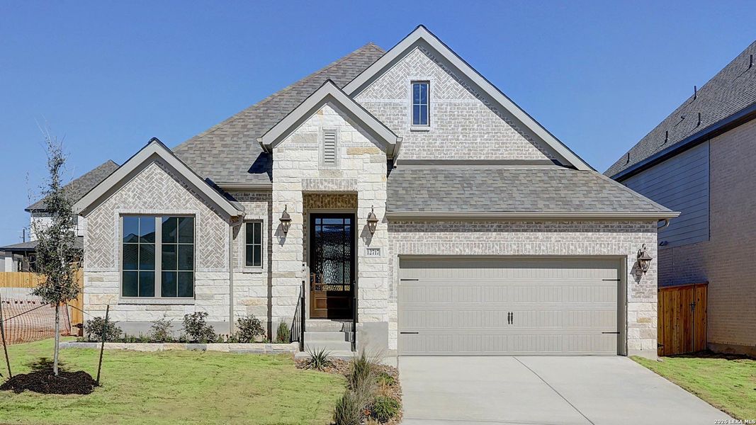 Front exterior of a new home in Arcadia Ridge, San Antonio, TX, highlighting curb appeal (Image 2). Front exterior of a new home in Arcadia Ridge, San Antonio, TX, highlighting curb appeal (Image 2).