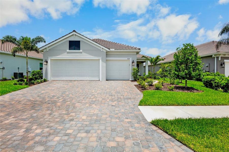 Front exterior of a new home in , Sarasota, FL, highlighting curb appeal (Image 22). Front exterior of a new home in , Sarasota, FL, highlighting curb appeal (Image 22).