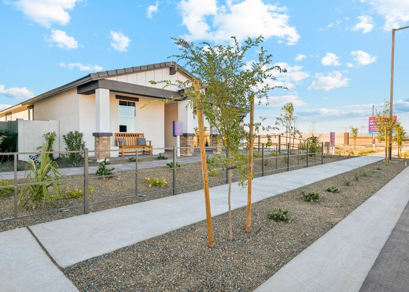 A building with a fence and trees. A building with a fence and trees.