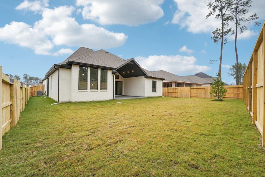 Exterior details and patio area of a home in Evergreen, Conroe (Image 4).