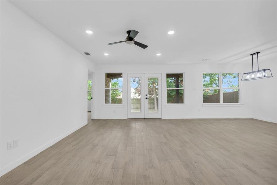 Unfurnished room with a ceiling fan, light wood-type flooring, and recessed lighting