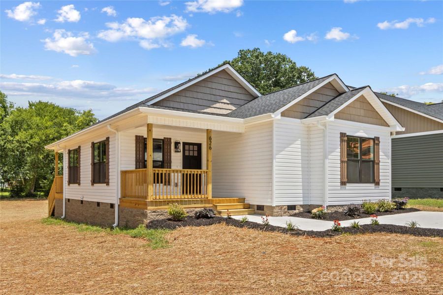 Front exterior of a new home in , Statesville, NC, highlighting curb appeal (Image 1). Front exterior of a new home in , Statesville, NC, highlighting curb appeal (Image 1).