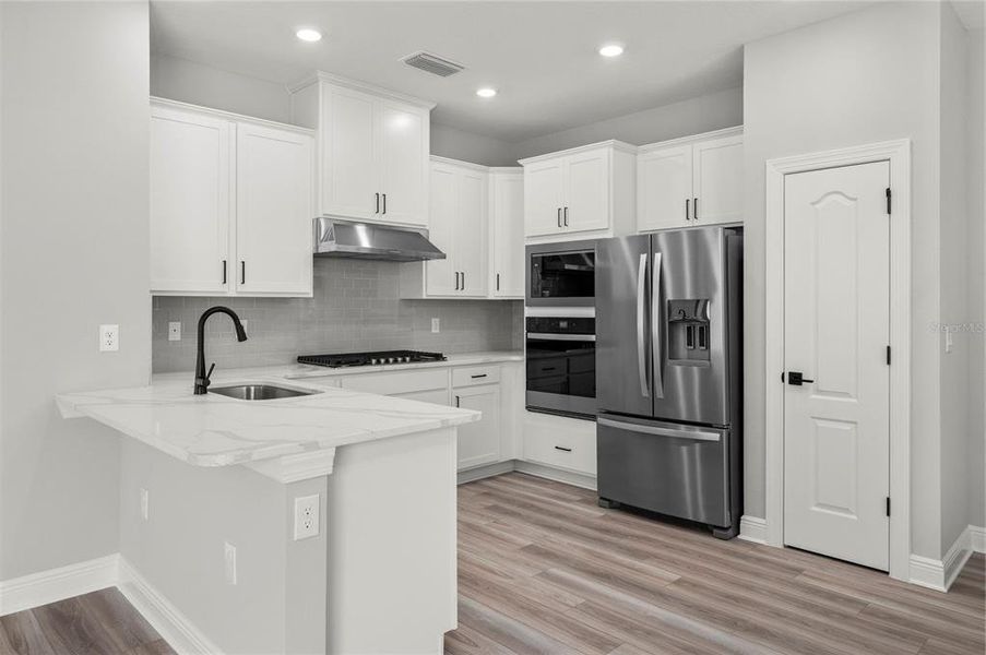 Furnished interior view inside a new home in , Kissimmee (Image 2). Furnished interior view inside a new home in , Kissimmee (Image 2).