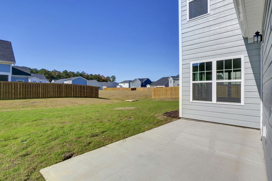 Exterior details and patio area of a home in Grand Park, Leland (Image 3).