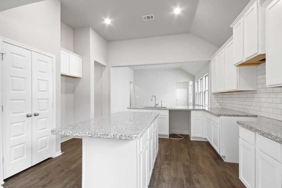 Center island in kitchen for added prep space (*Photo not of actual home and used for illustration purposes only.) Center island in kitchen for added prep space (*Photo not of actual home and used for illustration purposes only.)