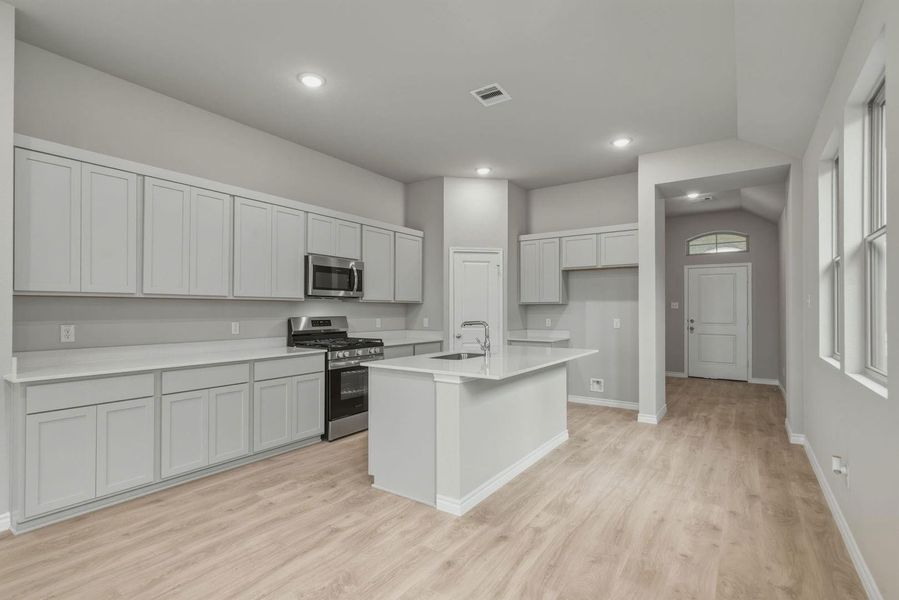 Kitchen in the Cedar home plan by Trophy Signature Homes – REPRESENTATIVE PHOTO