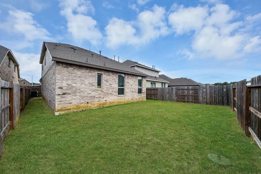 Exterior details and patio area of a home in The Trails, New Caney (Image 28).