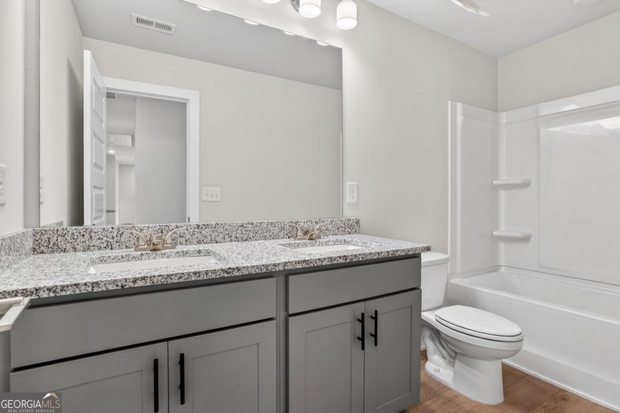 Furnished interior view inside a new home in The Fairways at Mirror Lake, Villa Rica (Image 10).