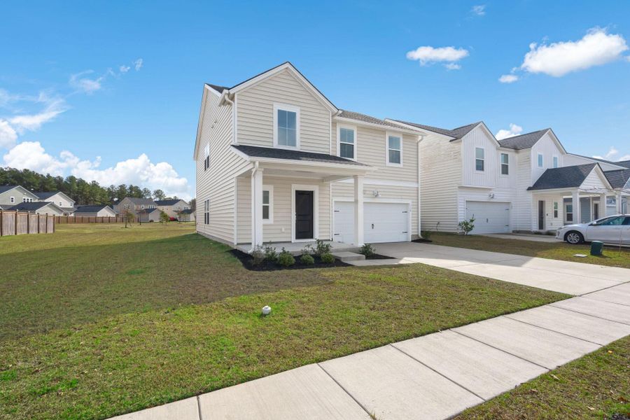 Front exterior of a new home in , Summerville, SC, highlighting curb appeal (Image 2). Front exterior of a new home in , Summerville, SC, highlighting curb appeal (Image 2).
