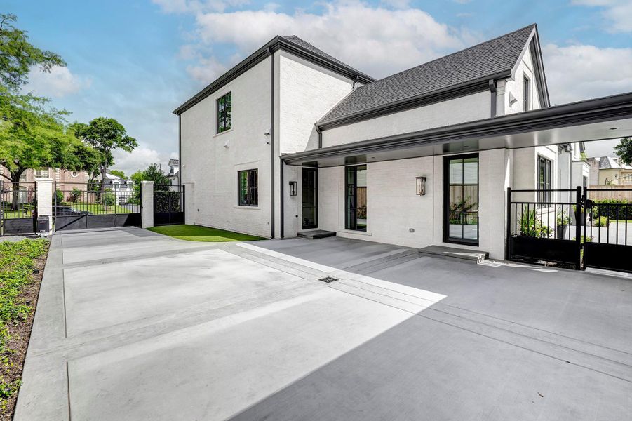Lots of room for children to play or for parking behind the gate.  Gutters tied to french drain to street.