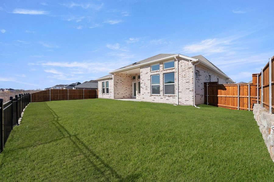 Exterior details and patio area of a home in Devonshire, Forney (Image 24).
