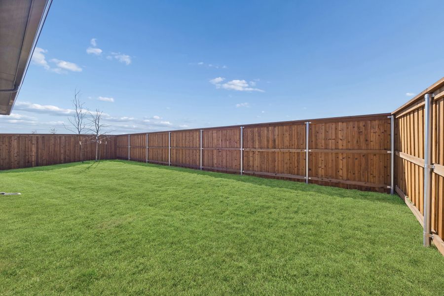 Covered Patio in the Wimbledon home plan by Trophy Signature Homes – REPRESENTATIVE PHOTO