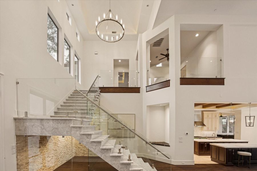 Striking marble staircase leads to the private north wing of the home, where four spacious secondary bedrooms are thoughtfully arranged. Each features its own ensuite bath, and complemented by a comfortable family lounge that creates the perfect retreat for family or guests. Striking marble staircase leads to the private north wing of the home, where four spacious secondary bedrooms are thoughtfully arranged. Each features its own ensuite bath, and complemented by a comfortable family lounge that creates the perfect retreat for family or guests.
