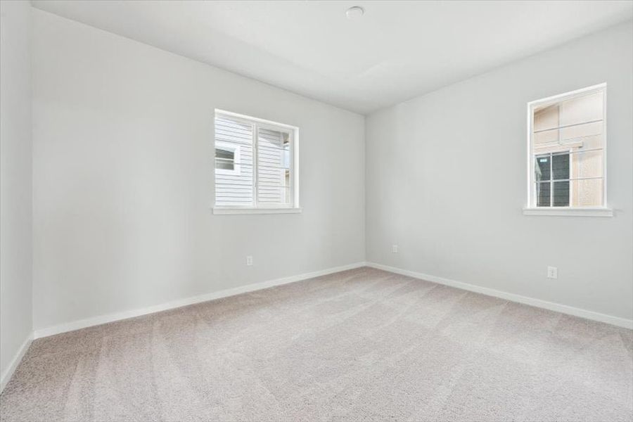 A room with a window and a white wall. A room with a window and a white wall.