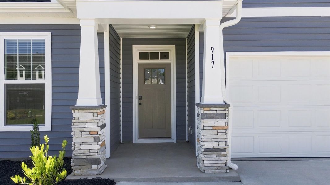 Exceptional home with tasteful exterior finishes and a thoughtfully designed façade at Fox Hollow