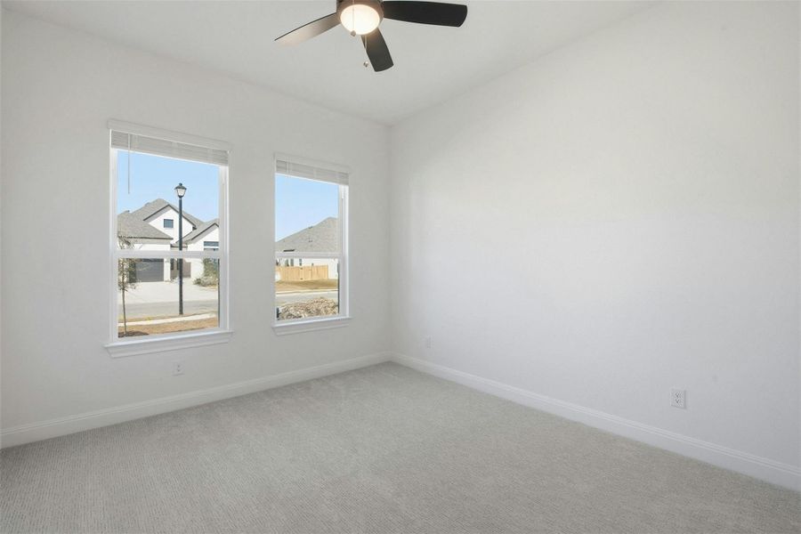 Unfurnished room with carpet and ceiling fan