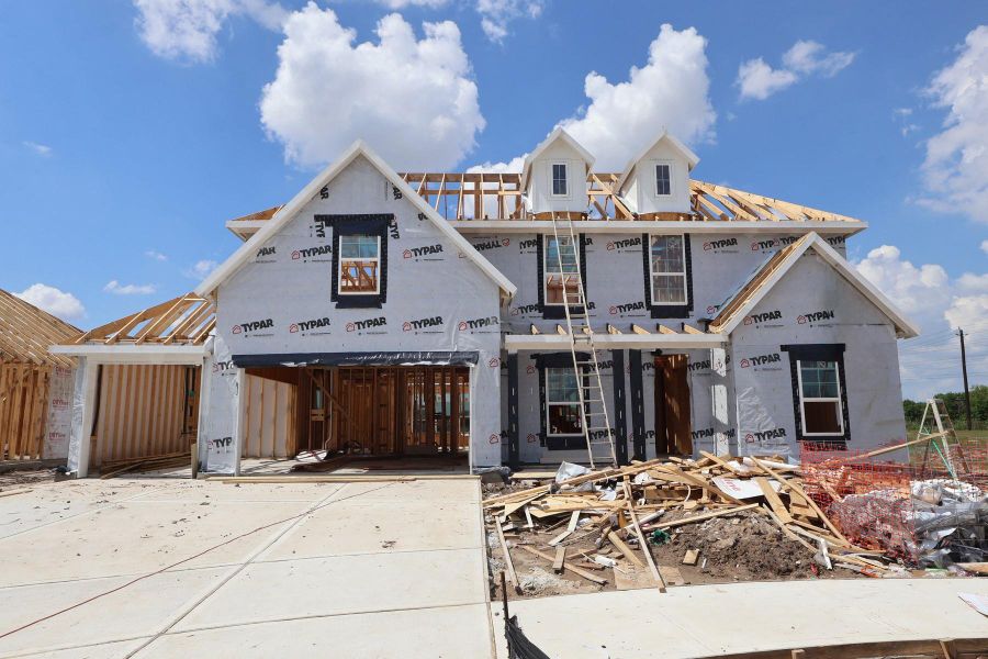 Two story home with 5 beds, 4.5 baths, and 3 car tandem garage