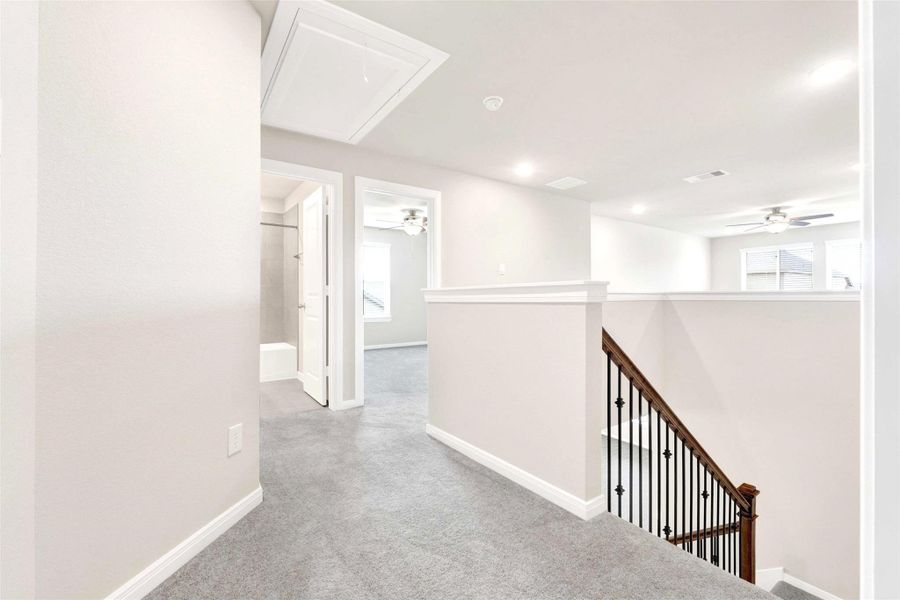 upstairs leads to flex space with bedrooms surrounding