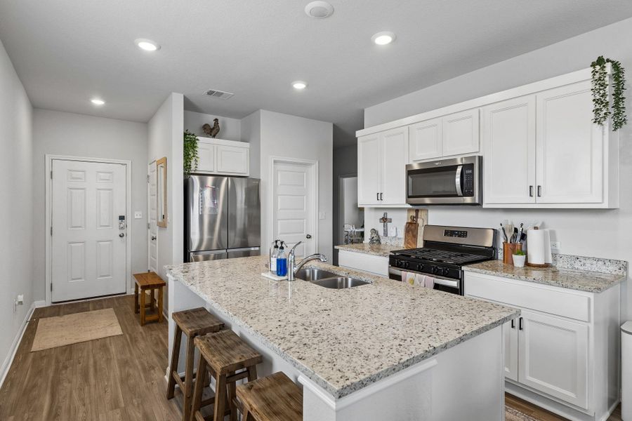 Furnished interior view inside a new home in Stallion Run, Buda (Image 6).