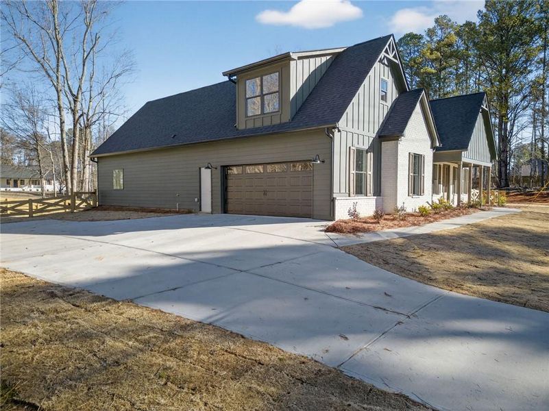 Front exterior of a new home in , Douglasville, GA, highlighting curb appeal (Image 24).
