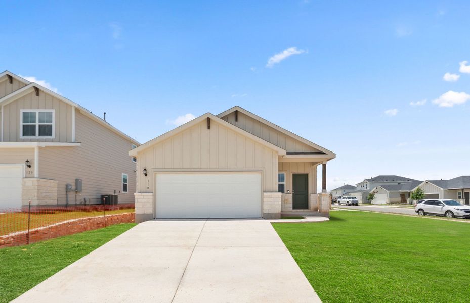 Front exterior of a new home in Sunfield, Buda, TX, highlighting curb appeal (Image 2). Front exterior of a new home in Sunfield, Buda, TX, highlighting curb appeal (Image 2).