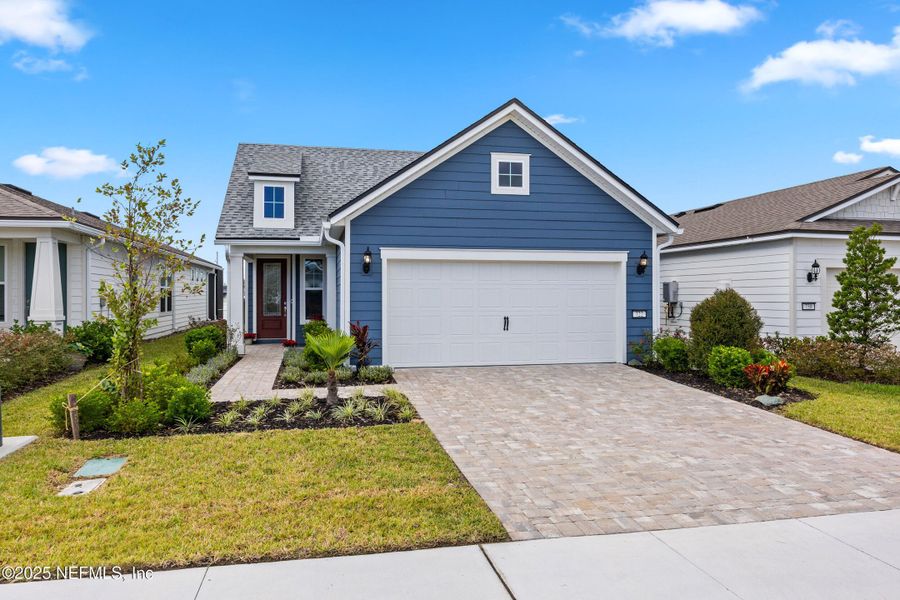 Front exterior of a new home in , Yulee, FL, highlighting curb appeal (Image 1).