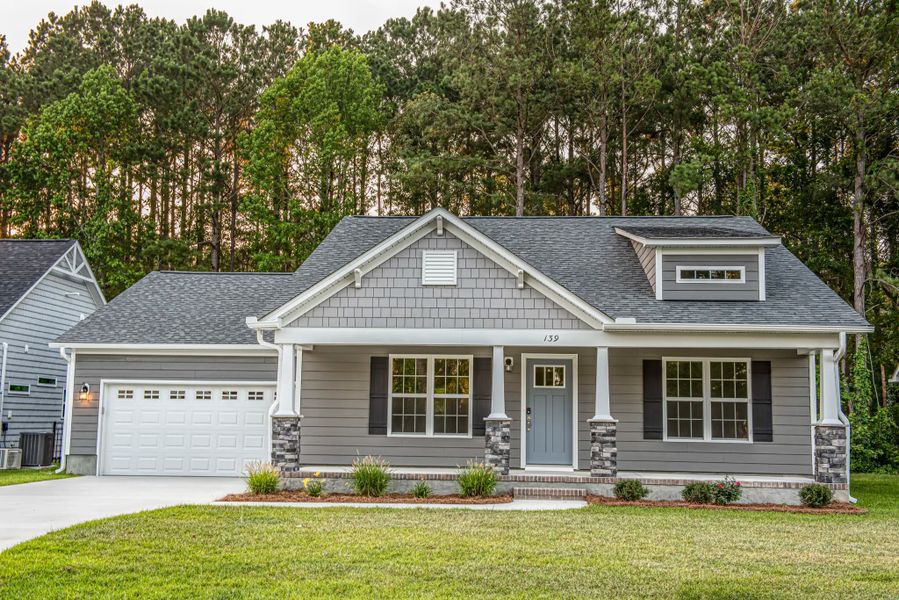 Representative exterior photo of a completed home built from the Kids 2 Car by JC Jackson Homes,LLC in Heritage Pointe, Newport, NC (Image 15).