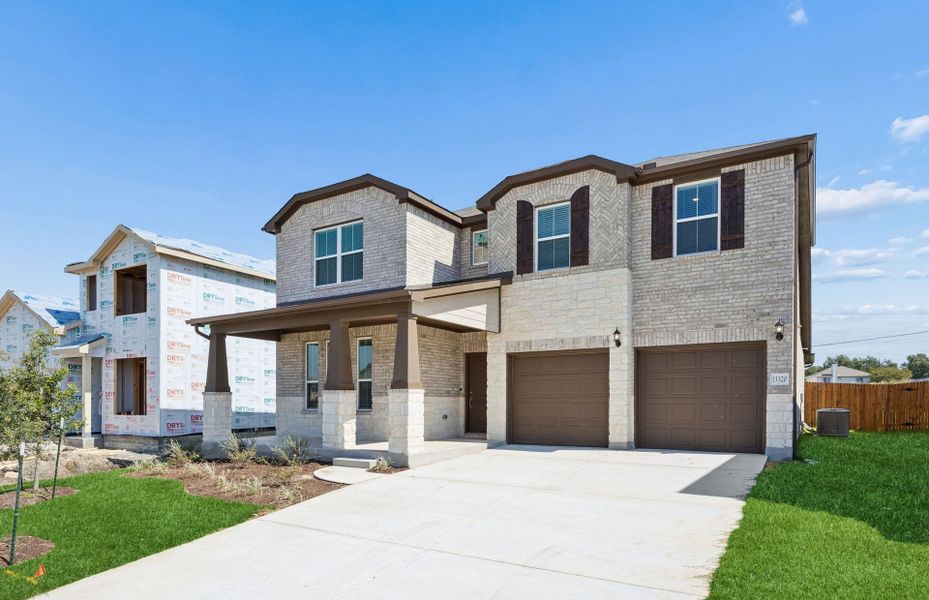 Front exterior of a new home in Lagos, Manor, TX, highlighting curb appeal (Image 17).