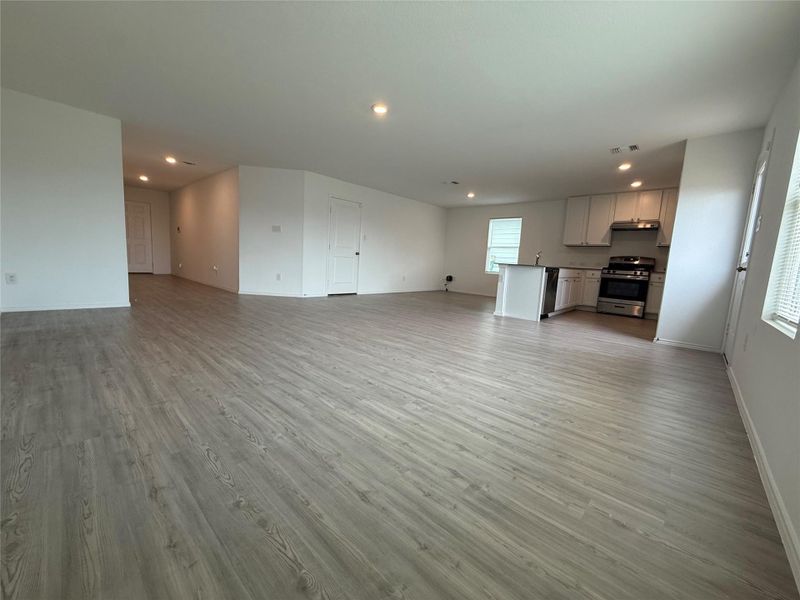 living room with recessed lighting and light wood-style flooring