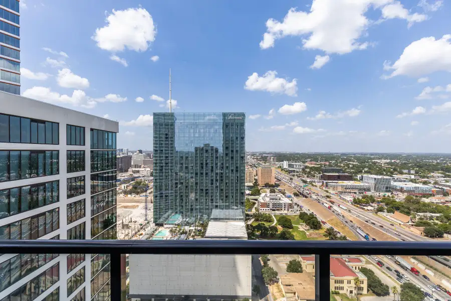 City skyline views from a private balcony.
