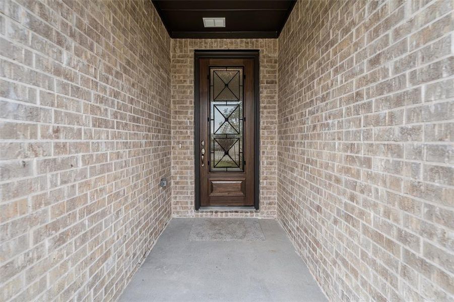 View of exterior entry featuring brick siding View of exterior entry featuring brick siding