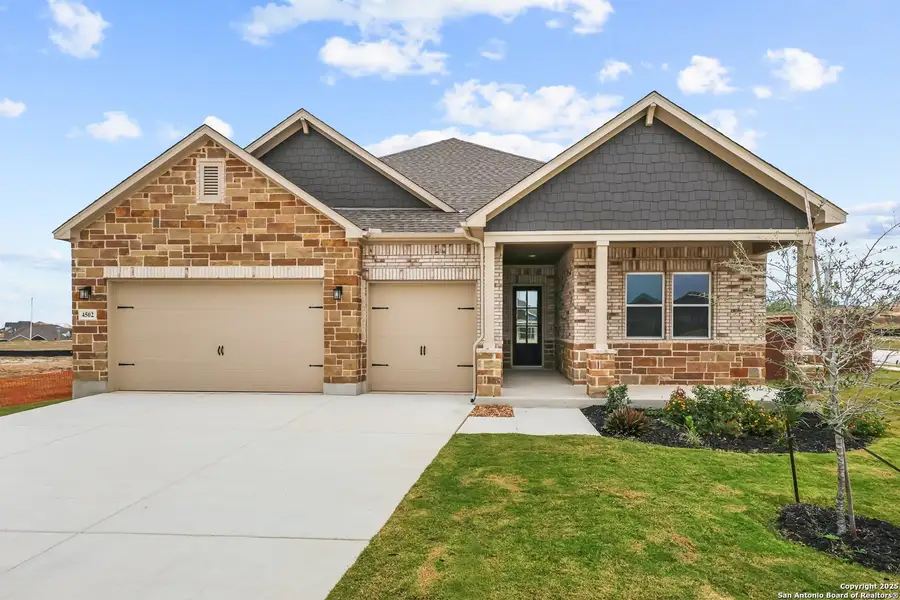 Front exterior of a new home in Homestead, Schertz, TX, highlighting curb appeal (Image 1).