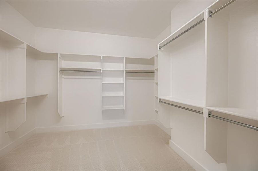 Walk in closet with light carpet Walk in closet with light carpet