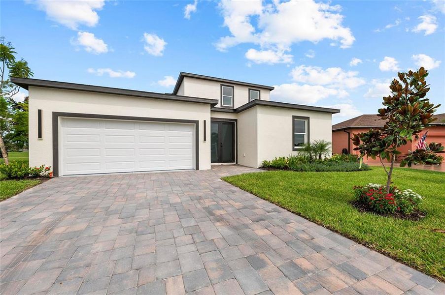 Front exterior of a new home in , Palmetto, FL, highlighting curb appeal (Image 25).