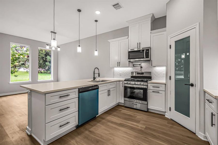 A corner walk in pantry provides plenty of storage.