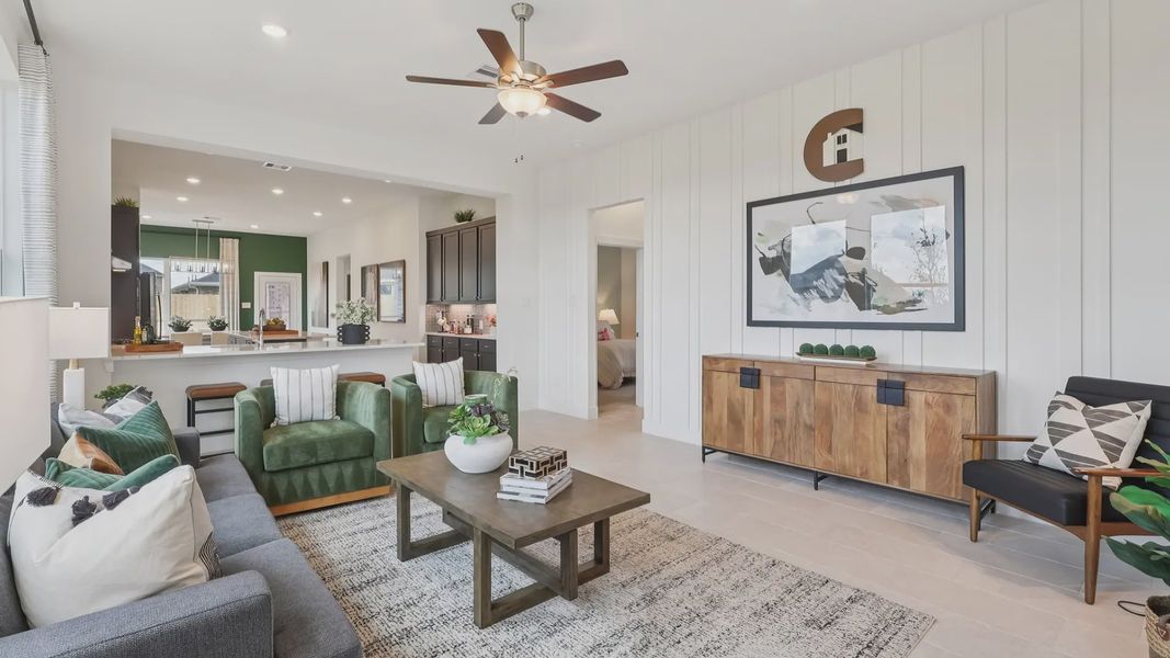 Representative furnished interior of a home built from the Adele by Chesmar Homes in Sunterra, Katy (Image 5).