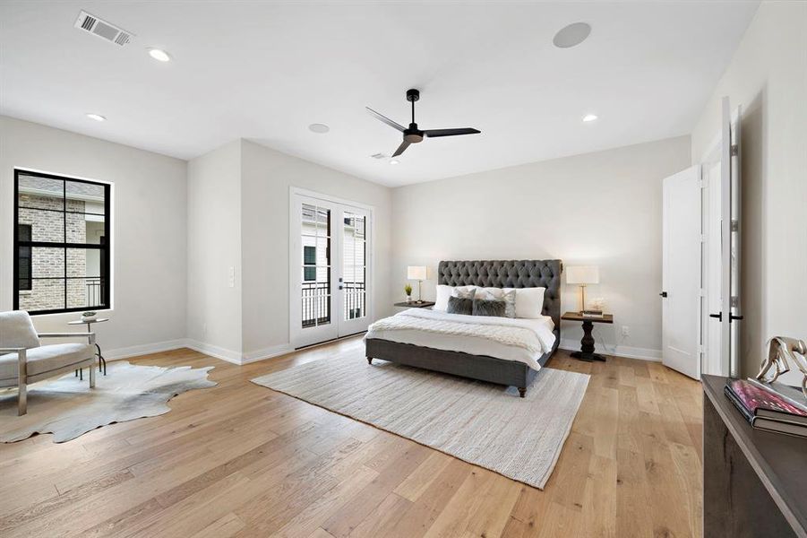 The wide plank white oak floors continue into the spacious owner's retreat.