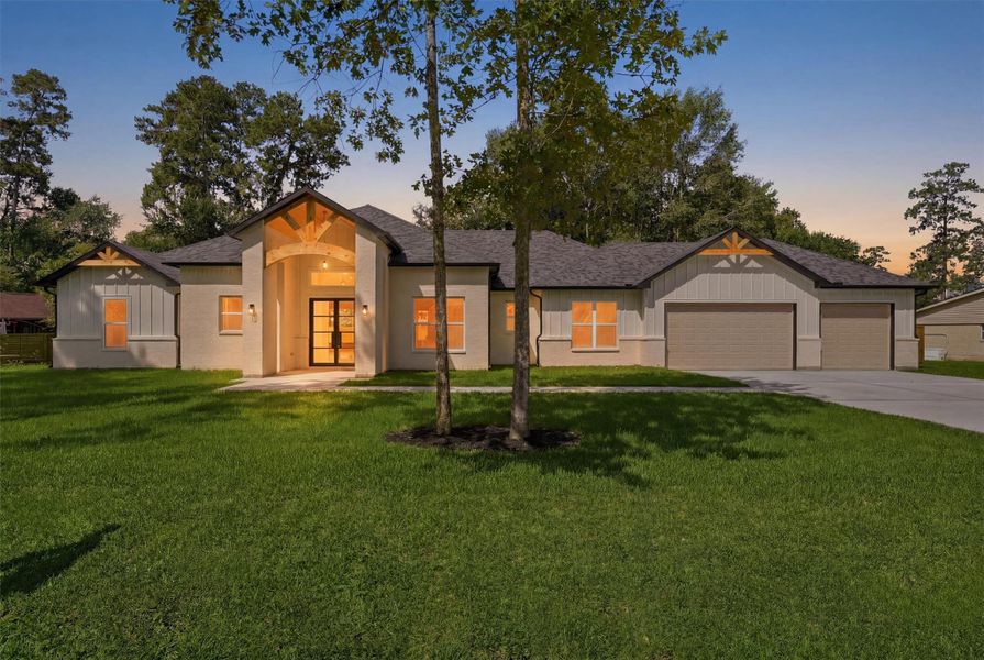 Front exterior of a new home in , Roman Forest, TX, highlighting curb appeal (Image 21).