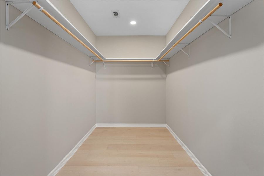 Expansive walk-in closet withhigh ceilings and ampleshelving. Organized luxurymeets everyday convenience.