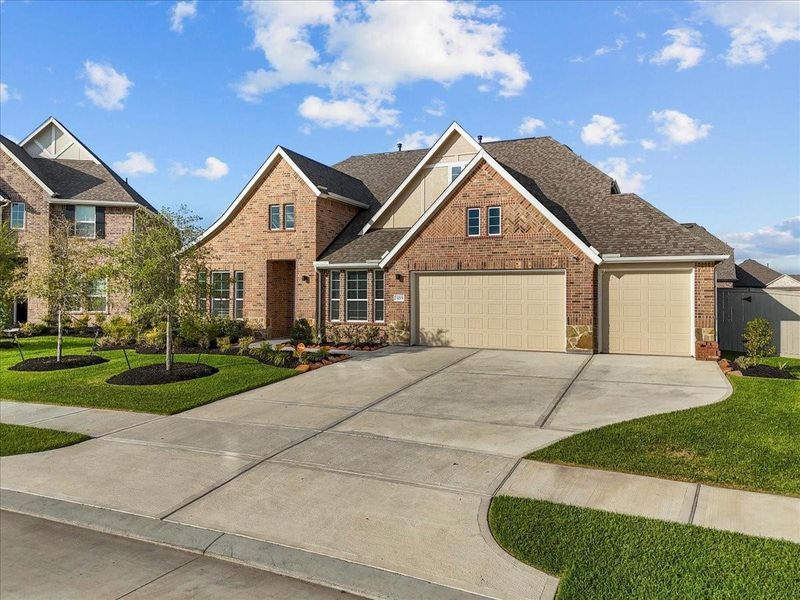 Front exterior of a new home in Westland Ranch - 70' Homesites, League City, TX, highlighting curb appeal (Image 22).