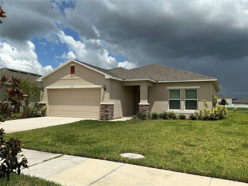 Front exterior of a new home in , Kissimmee, FL, highlighting curb appeal (Image 2). Front exterior of a new home in , Kissimmee, FL, highlighting curb appeal (Image 2).