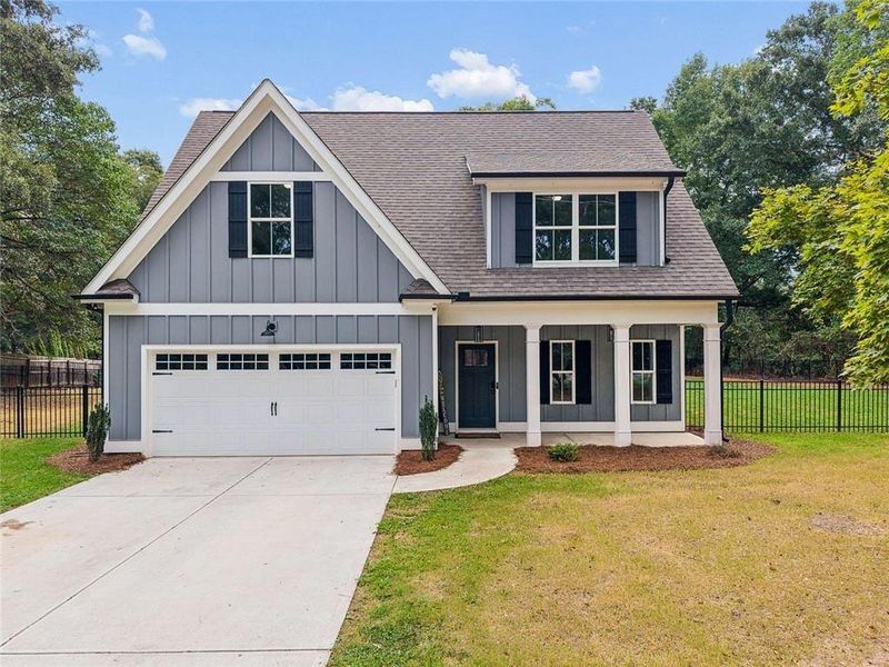 Front exterior of a new home in , Covington, GA, highlighting curb appeal (Image 27).