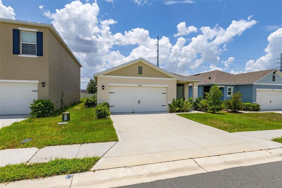Front exterior of a new home in , Kissimmee, FL, highlighting curb appeal (Image 23). Front exterior of a new home in , Kissimmee, FL, highlighting curb appeal (Image 23).