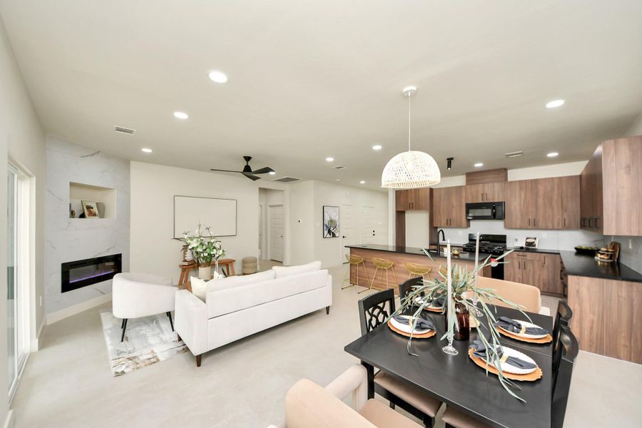 A seamless transition from the kitchen to the sun-filled dining area